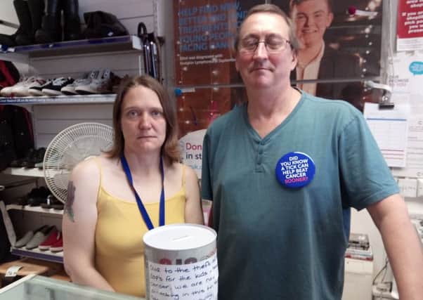 Cancer Research volunteers Shantell Christie and Steve Palmer with the shop's new 'kids and teens' cancer fund