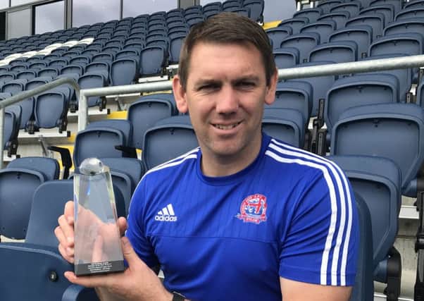 AFC Fylde boss Dave Challinor with his managerial award