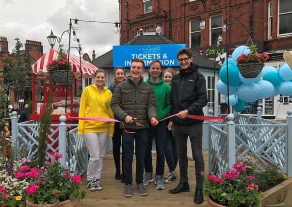 Lytham Festival hub opens in Lytham Piazza.  Hub assistants Gemma Westgate and Ellie Wylie with Hub designer Greg Anderton of Leafy Lytham, Paul Heywood (Hub Manager), Eadie Sowden (Hub assistant) and Joe Robinson of promoters Cuffe and Taylor