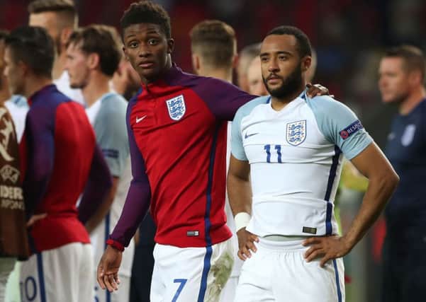 Nathan Redmond being consoled by Demarai Gray after his missed penalty meant England went out of the UEFA European Under-21 Championship on Tuesday night