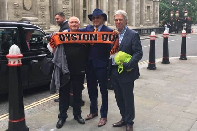 Owen Oyston with Pool fan Ray Gregson and a member of his legal team outside High Court on Wednesday