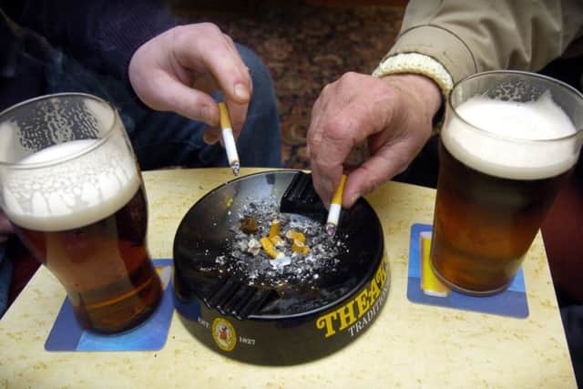 A pint and a cigarette, not something we see inside pubs anymore