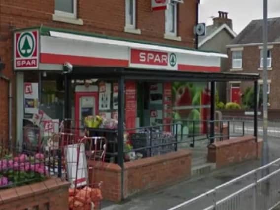 The balaclava-clad men burst into the Post Office in the spar on Lytham Roadand threatened a female member of staff