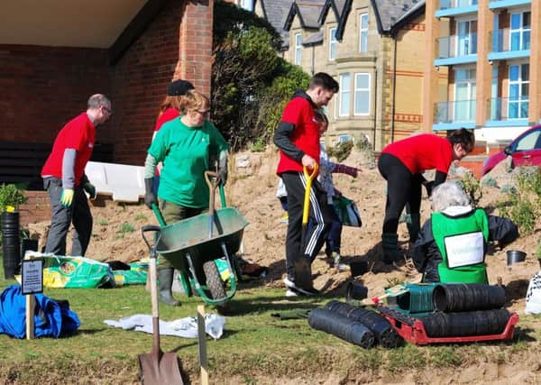 Volunteers hard at work on St Annes In Bloom's project to refurbish the Peace and Happiness Garden on St Annes seafront