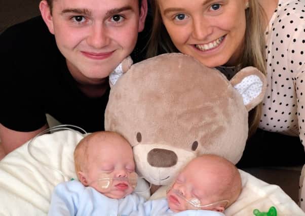 Jack Staff and Rosie Sargeant with new born twins Carson (left) and Carter. Pic: MARTIN BOSTOCK