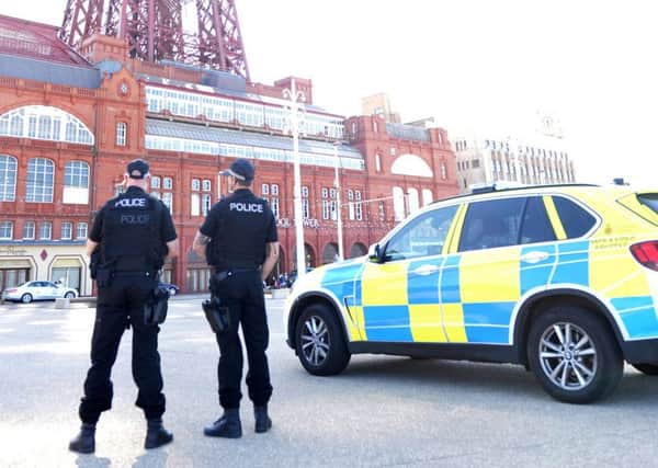 Armed police in front of the Tower in May