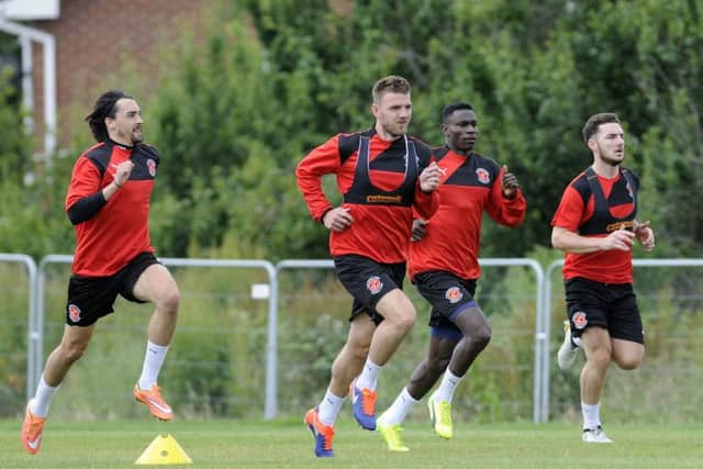 Fleetwood Town FC pre-season training. Markus Schwabl, Ash Eastham, Godswill and new signing Lewie Coyle