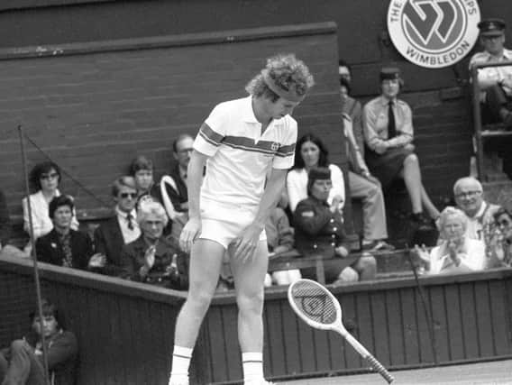 John McEnroe throwing his racket in anger during his stormy semi-final match against Australian Rod Frawley