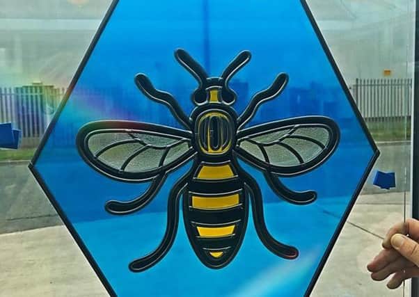 the stained glass worker bee mural that was made in memory of those who died in the Manchester Arena terror attack