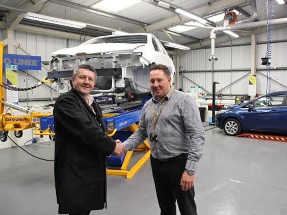 Robert Oldale, Automotive Centre Manager at B&FC, welcomes Barry Gregson to the team in the new Auto Repair Centre