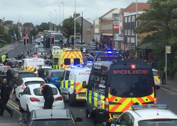 Police on the scene as a large group of bikers bring Devonshire Road in Blackpool to a halt.