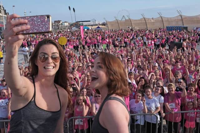 Wedding Singer stars Cassie Compton and Lucie Jones take a selfie onstage before the race starts