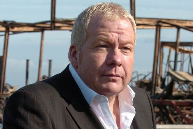 Mike Simmons in front of the wrecked Fleetwood Pier, after the blaze there in September 2008.