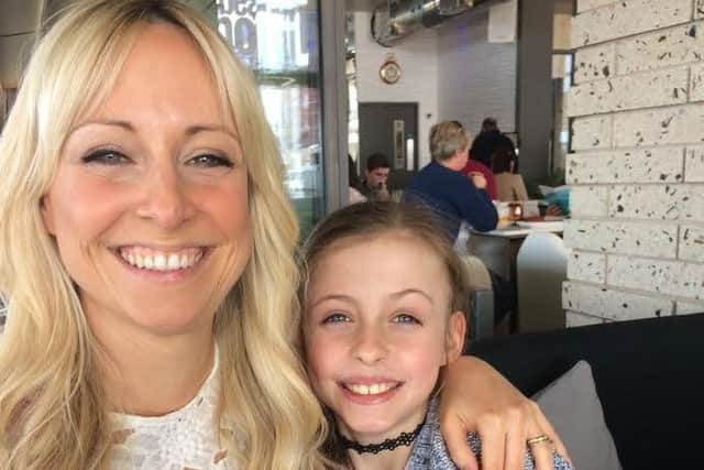 Emma Lyons, who was diagnosed with melanoma after using sunbeds as a teen, with her daughter Phoebe