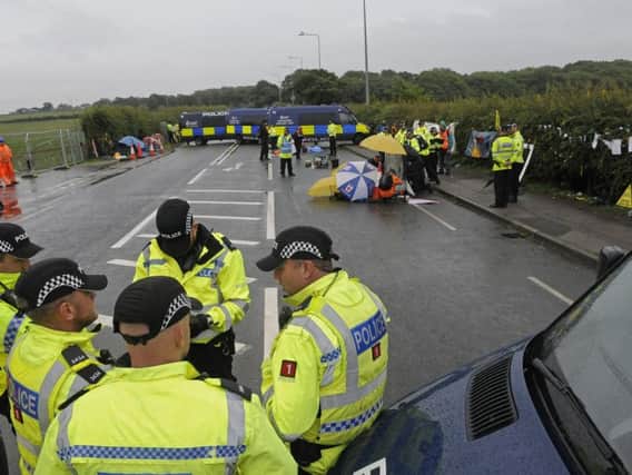 Police closed the A583 Preston New Road after three anti-fracker protesters locked themselves together to block deliveries to the shale gas drilling site.