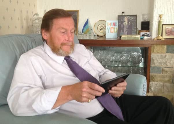 Lytham councillor Mark Bamforth on his computer tablet