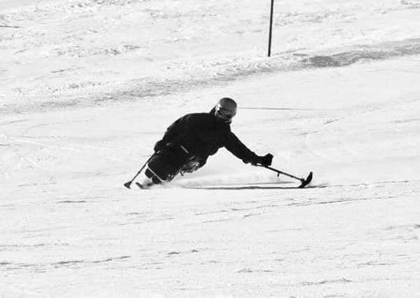 Josh Landmann, sit skiiing