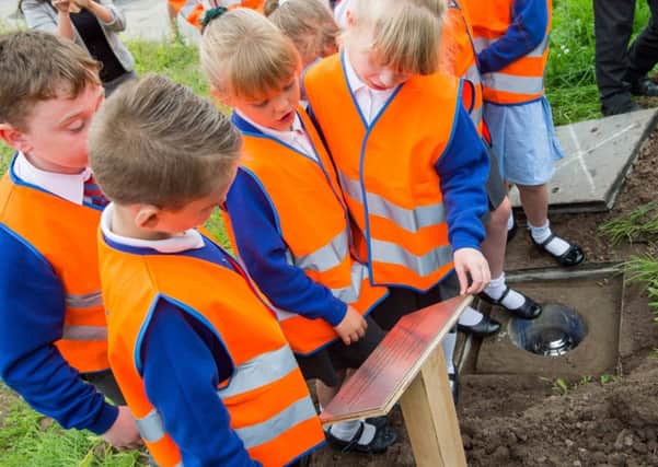 Schoolchildren and councillors have buried a time capsule to commemorate the official reopening on Crossleys Bridge in Blackpool.