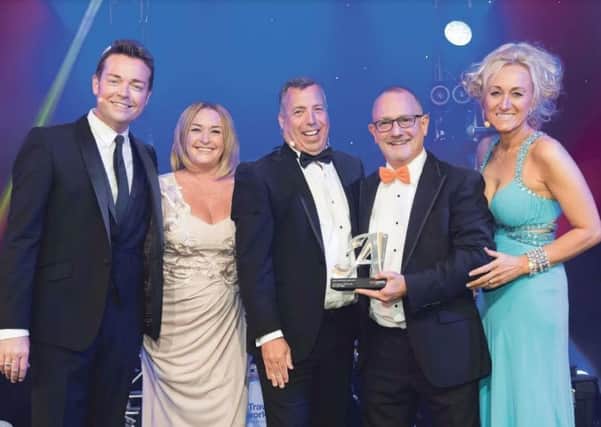 The Rivercruising.co.uk team pick up their award from TV star Stephen Mulhearn and Lucy Huxley, right