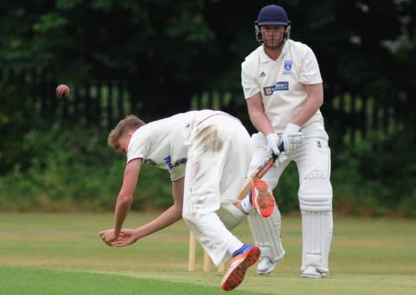 Jack Saunders close to a caught and bowled
