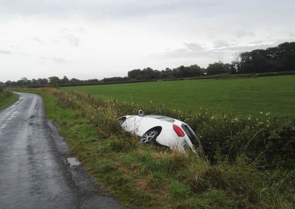 A white Mercedes was found in a ditch off Lodge Lane. Picture from Lancs road police