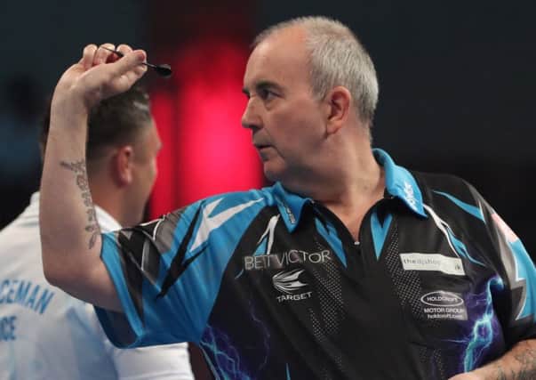 Phil Taylor saw off Gerwyn Price to reach the second round last night    Picture: Lawrence Lustig/PDC
