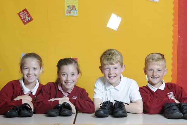 Pupils at Northfold Primary will be donating their shoes to charity.  L-R Phoebe Ritchie, 9, Amber Davis, 10, Ben Pennington, 10, and Shane Wilson, 10.