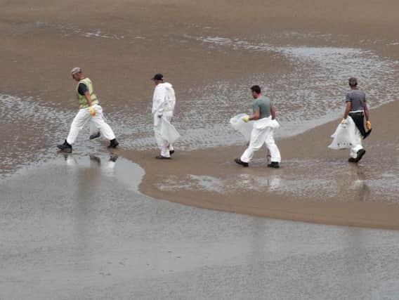 Beach cleaners have worked hard to clean up the oil spill