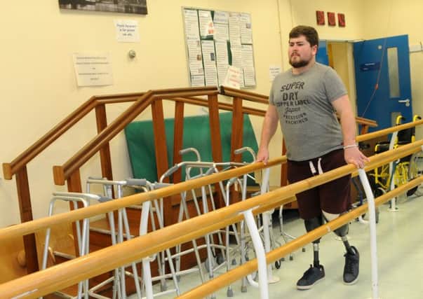 Jacob Gray, 23 is learning to walk after having both legs ampulated after meningitis and septicemia