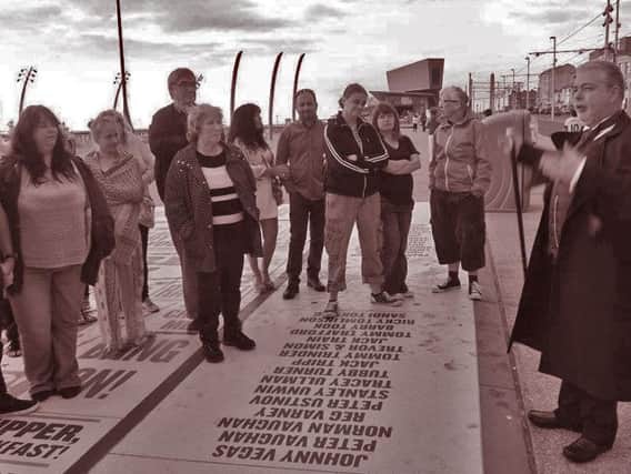 Stephen Mercer guides a tour at the Comedy Carpet