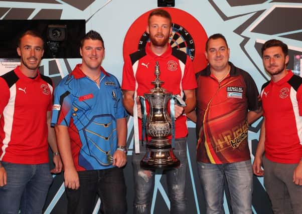 Alex Cairns, Cian Bolger and Lewie Coyle with Daryl Gurney and Kim Huybrechts   Picture: Lawrence Lustig/PDC