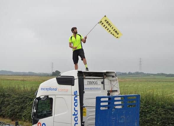 A protester on top of a supply lorry, image courtesy of Reclaim the Power