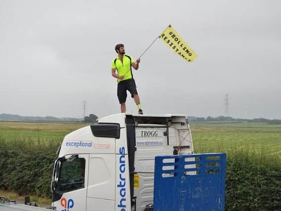 A protester on top of a supply lorry, image courtesy of Reclaim the Power