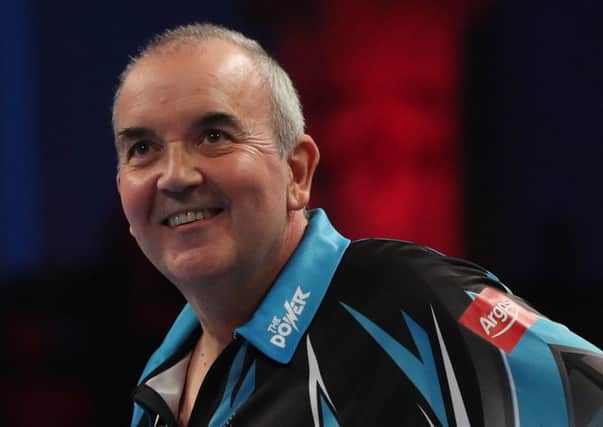 Phil Taylor comfortably defeated Michael van Gerwen to reach the last four 	Picture: Lawrence Lustig/PDC