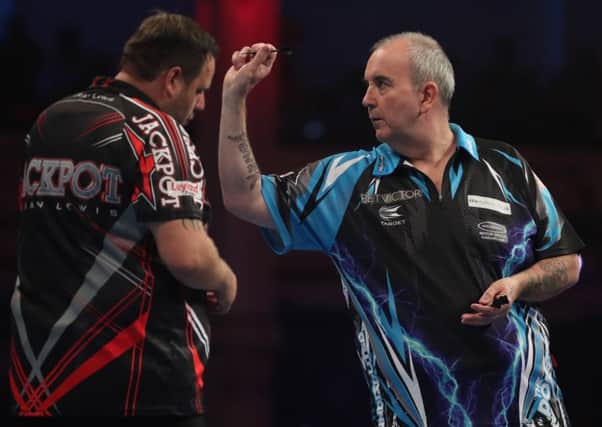 Phil Taylot defeated Adrian Lewis to set up a final against Peter Wright    PICTURE: LAWRENCE LUSTIG/PDC