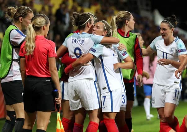 England's Jodie Taylor celebrates her goal against France with team-mates