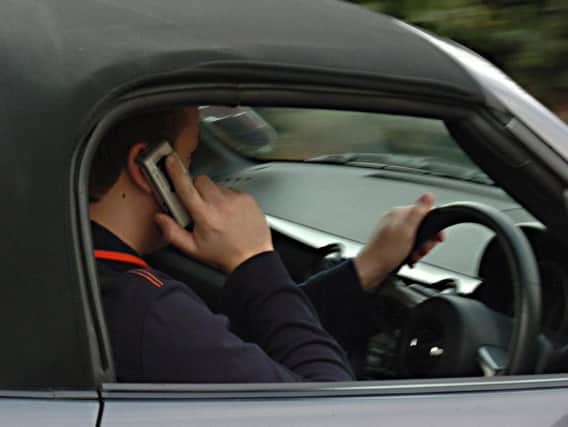 Mobile phone use by drivers