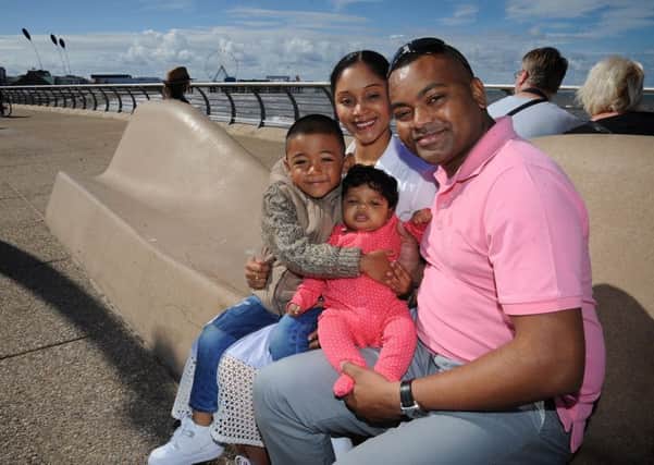 Johnson on the promenade with wife Malissa and children Ayden (4) and three-month-old Aniya