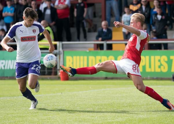Rotherham United's Joe Newell battles with Fleetwood Town's Kyle Dempsey