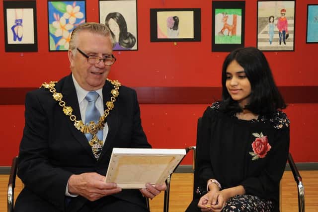 12 year-old budding artist Chamathka Loku Yaddehige had the honour of showing Blackpool mayor Councillor Ian Coleman round her first exhibition, showing at Blackpool Sports Centre.
The mayor admires one of Chamathka's works.  PIC BY ROB LOCK
7-8-2017