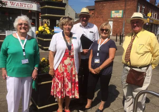Fleetwood and Cleveleys Lions members Margaret Harris, Pamila Hamilton (president) and Margaret Purcell with two North West in Bloom judges.