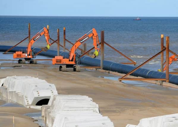 Workers installing the pipe at Anchorsholme