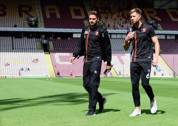Clark Robertson gets a feel for the Bradford City pitch with fellow defender Will Aimson last weekend