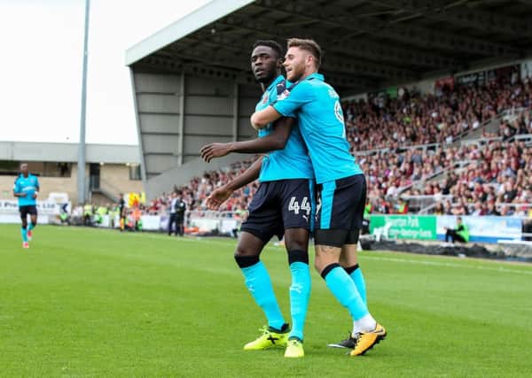 Fleetwood Town's Devante Cole celebrates with Wes Burns after opening the scoring at Northampton