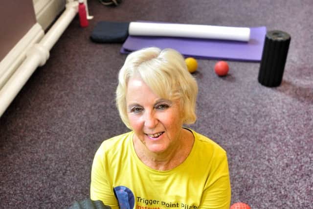 Picture by Julian Brown 14/08/17

Lynda Holmes pictured with the device in her class.

Pulseroll classes, a new type of class using vibrating foam rollers to release muscles which is being held in St Annes.