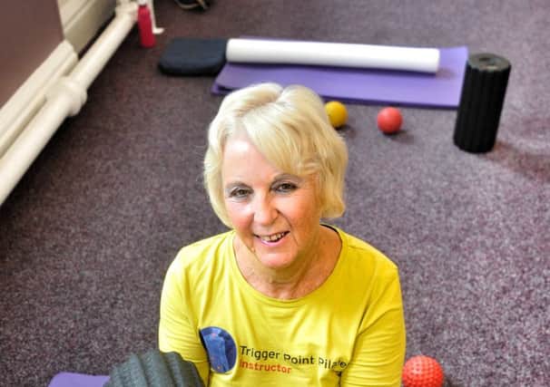 Picture by Julian Brown 14/08/17

Lynda Holmes pictured with the device in her class.

Pulseroll classes, a new type of class using vibrating foam rollers to release muscles which is being held in St Annes.
