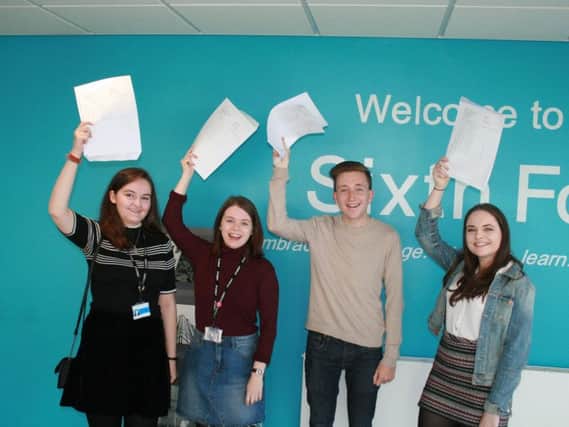 Delighted students picking up their A-level results at St Marys. Pictured (L to R)are: Alice Townsend, Monica Brownwood, Nathan Leahy and Molly Barnes