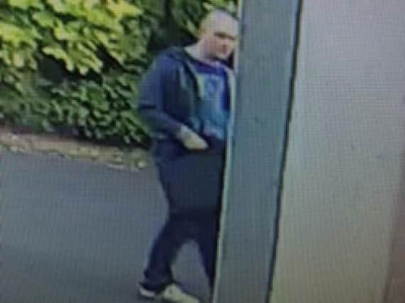 Police want to speak to this man, caught on camera in St Annes Road, South Shore, as they continue to hunt a serial flasher (Pic: Lancashire Police)