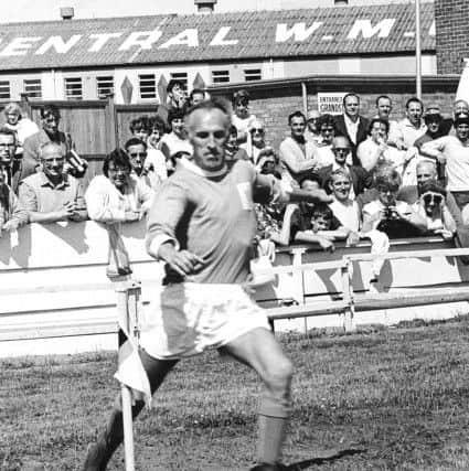 Bruce Forsyth playing football for the showbiz 11 in a Blackpool kit in 1965