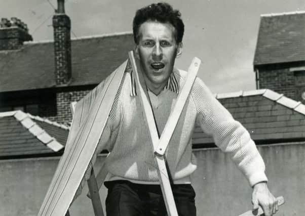 Sir Bruce Forsyth has trouble with his deckchair in Blackpool in 1960 seaside stars